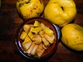 Sliced Ã¢â¬â¹Ã¢â¬â¹fresh quince and three large fruit quince